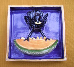 Starling  teetering on a cantaloupe.