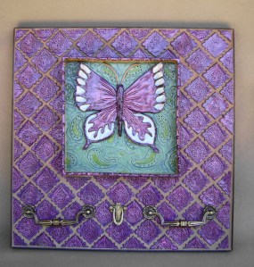 20" square Wall Hanging Shadow box with floating butterfly surrounded with handmade tiles and vintage drawer pulls for a pho function.