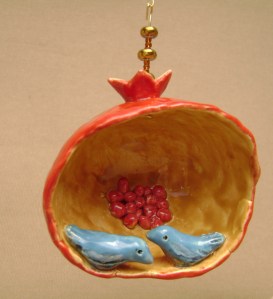 Blue birds in a  ceramic pomegranate ornament