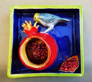 Verdin on a Pomegranate